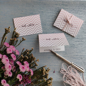 folded gift tags pink and grey chevron design with name personalised inside on silver blue background with pink daisy flowers on left side