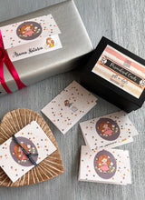 Folded gift card personalised with a name featuring a cute girl on an oval grey background surrounded by polka dots 