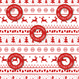 A piece of red and white Christmas wrapping paper with reindeer and the text 'Merry Christmas' and 'The U. Cruz Family'.