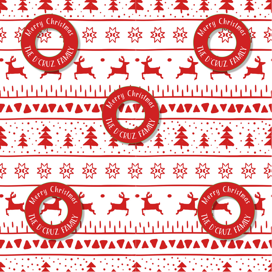A piece of red and white Christmas wrapping paper with reindeer and the text 'Merry Christmas' and 'The U. Cruz Family'.