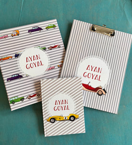 Customized school set with  cars, including a notebook, a clipboard, and a folder, each with personalized name branding.