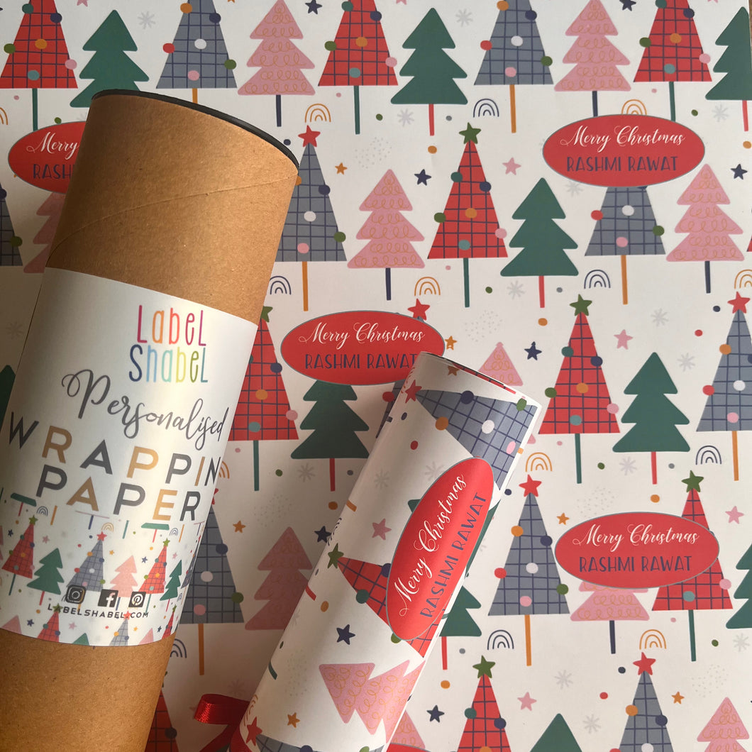 Wrapping paper with mutli coloured xmas tree on white background