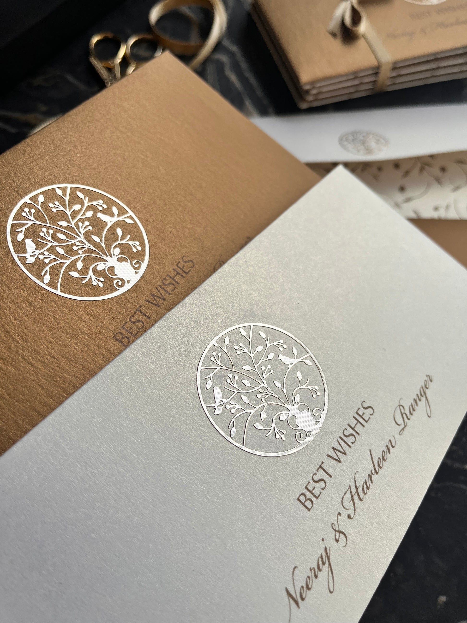 Close-up of decorative envelopes with intricate designs on a blurred background.