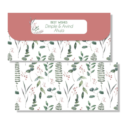 A set of gift envelopes with a leafy pattern design, including an envelope with a 'Best Wishes' message and a name written on it.