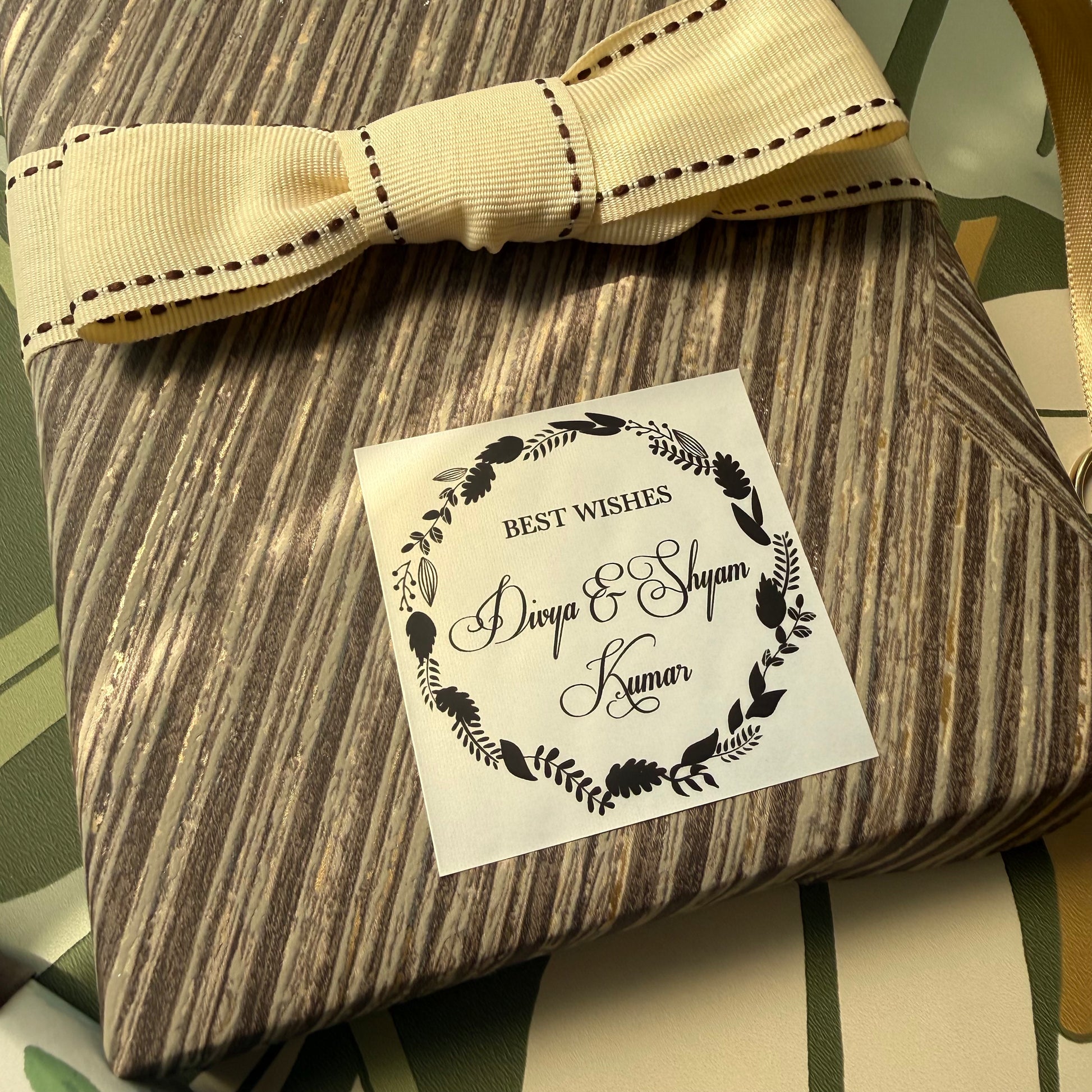 elaborate wreath design gift label with fancy cursive font