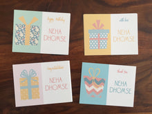 personalised gift cards with wrapped gifts in pastel colours
