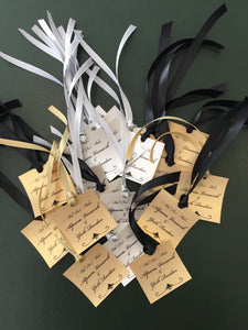 gift tags with ribbons in gold and silver paper