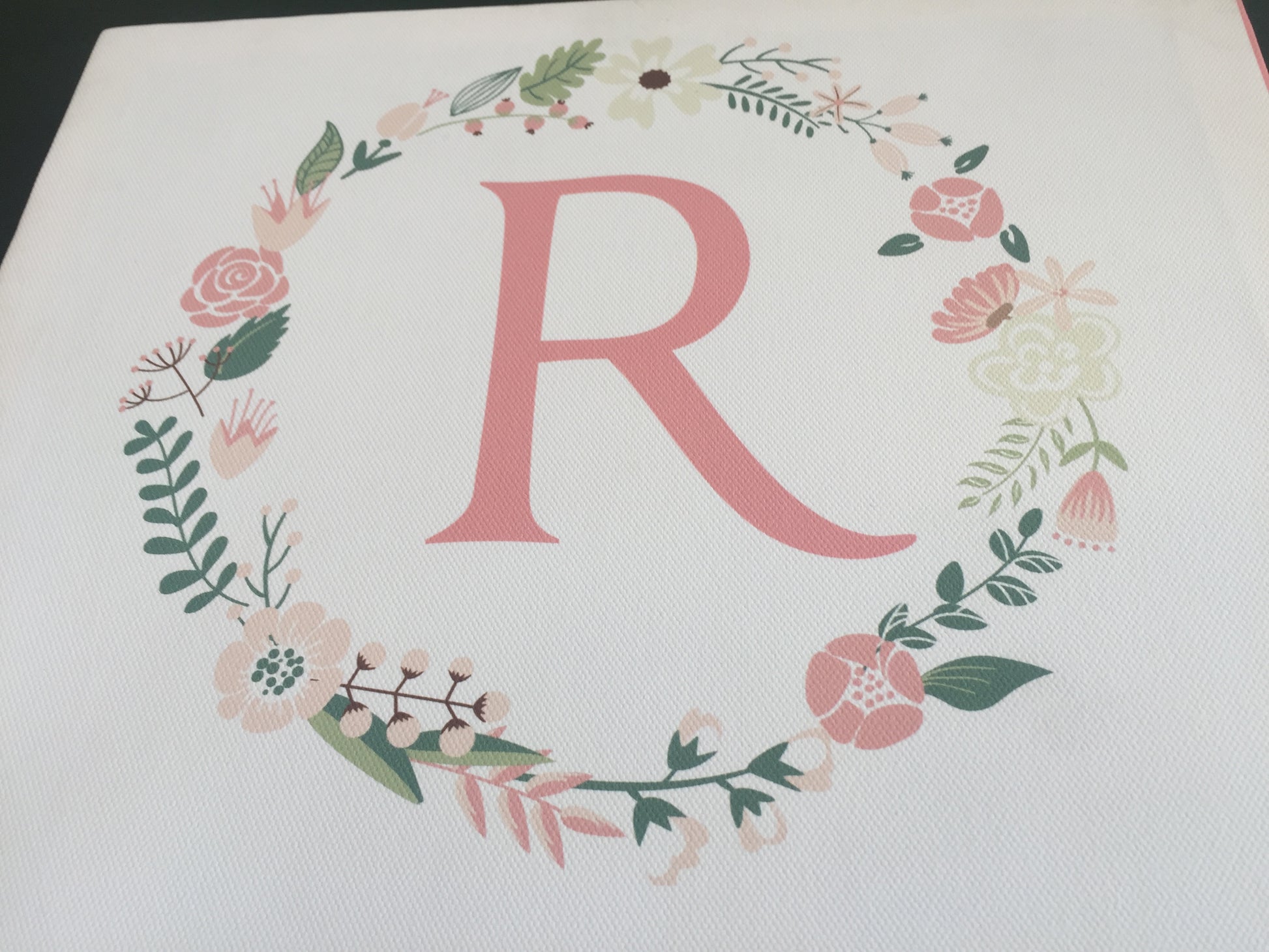 monogram  R with wreath 