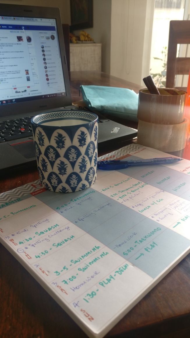 Weekly family planner with a schedule written