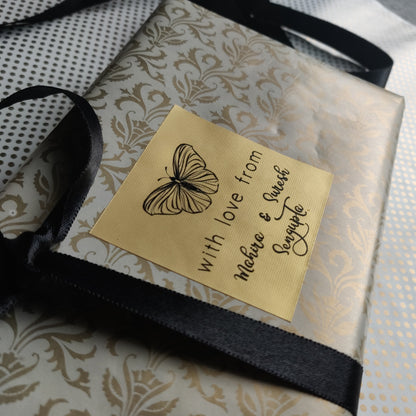 Butterfly gift label on gold paper