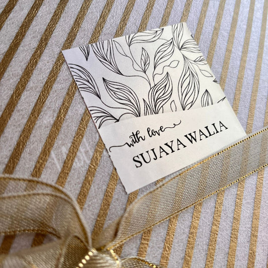 Gift label on metallic sheen paper with leaves pattern